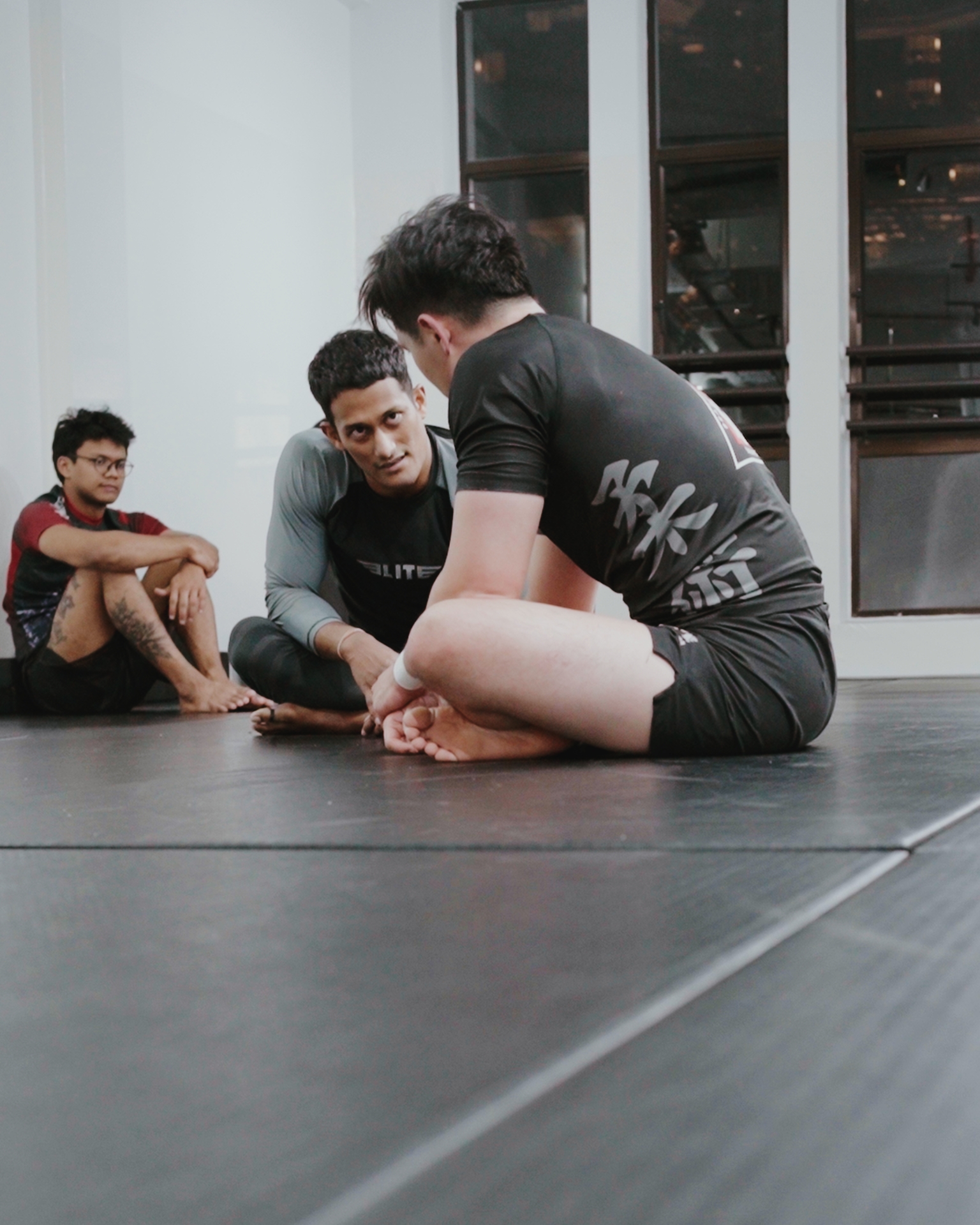 Coach answering questions on the mats